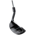 A golf putter with a black and silver design rests upright on its head showcasing grooves on the face which are designed for precision in putting on a smooth green surface.