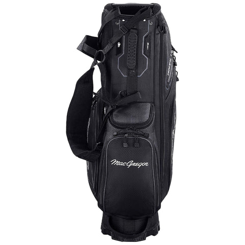 A black golf bag stands upright showcasing multiple compartments and adjustable straps designed for carrying golf clubs and accessories in outdoor settings such as a golf course. MacGregor branding is visible.