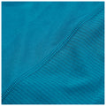 A piece of fabric in a vibrant teal color displays two different textures with a smooth section transitioning to a ribbed section along the edge showcasing careful stitching for durability.