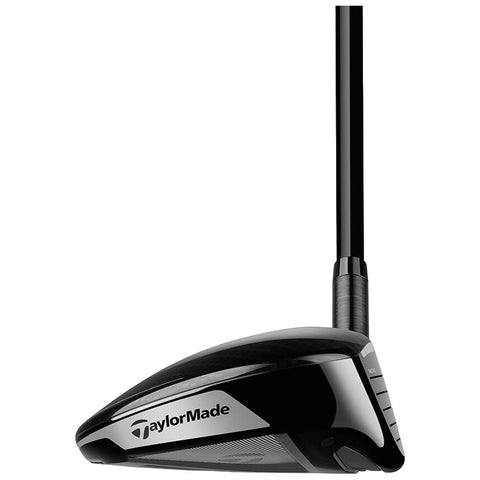 A golf driver with a sleek black head and a tapered shaft is positioned upright against a plain background showcasing the brand logo TaylorMade on the clubhead.