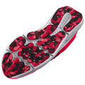 A brightly colored athletic shoe sole features a mix of red and black rubber surfaces with various textures and patterns designed for grip and traction on different surfaces.