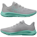 A pair of athletic shoes is presented showing a light gray upper with a textured design and a bright teal sole showcasing a breathable structure suitable for running or casual wear.