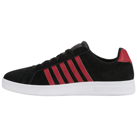 A black sneaker with red stripes and heel sits on a plain background showcasing its sleek design and textured material emphasizing a sporty yet casual style suitable for various settings.