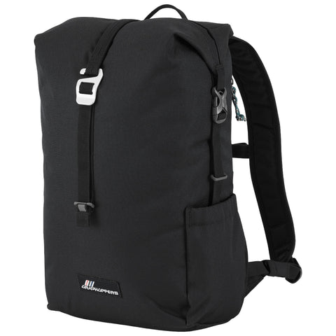 A black backpack stands upright featuring a large main compartment secured by a top flap and buckle straps with a side pocket highlighted against a plain background.