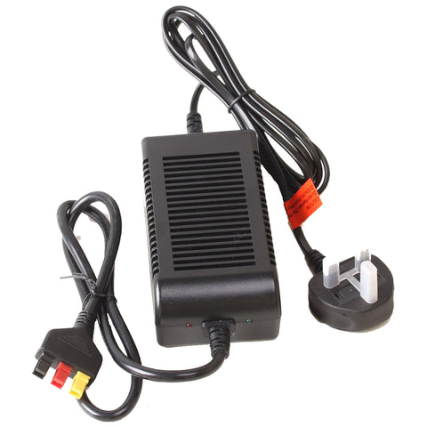 A black power adapter sits on a surface connected to a three-pronged plug with red yellow and black wires attached The device is designed for converting electrical current for devices