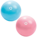 Two exercise balls are positioned side by side one is blue the other is pink both have textured surfaces and a central logo embossed on them indicating their use for fitness activities.