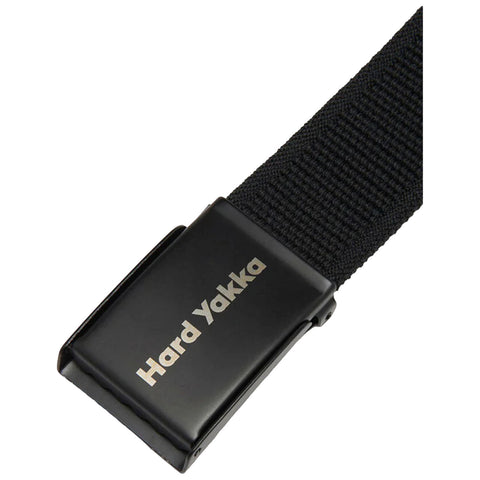 A black belt with a metallic buckle is displayed prominently the buckle features the engraving Hard Yakka showcasing a simple and functional design ideal for workwear or casual use