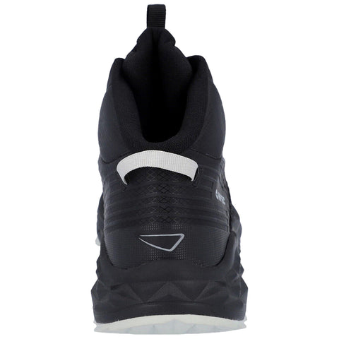 A black athletic shoe is upright with a prominent heel and textured design. It features a white pull tab at the back and is set against a plain background.