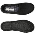 A black slip-on shoe is positioned flat with its upper and sole visible showing a textured fabric design and a rubberized tread detailing ideal for casual wear or light activities. The insole features the brand name Skechers and mentions air-cooled memory foam.