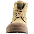 A beige high-top shoe is centered in the image with laces tied and eyelets visible showcasing a textured rubber sole designed for traction against a plain background.