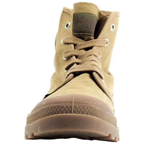 A beige high-top shoe is centered in the image with laces tied and eyelets visible showcasing a textured rubber sole designed for traction against a plain background.