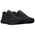 Black athletic shoes are displayed side by side showcasing a sleek design with laces and textured surfaces emphasizing their sporty look on a neutral background.