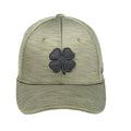 A green cap with a textured surface features a prominent black four-leaf clover emblem on the front, designed for casual wear or outdoor activities.