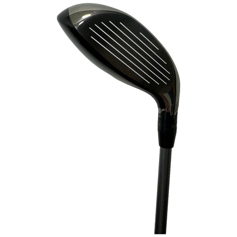 A golf club head is angled upward displaying a smooth black surface with white grooves. It is mounted on a thin shaft, designed for striking a golf ball on a course.