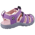 A purple and pink sandal sits upright showcasing a textured sole and adjustable straps highlighting its design for comfort and support suitable for outdoor activities.