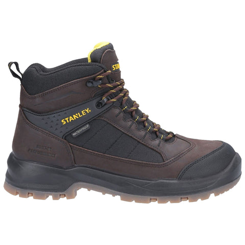 A brown waterproof work boot features durable materials and sturdy laces it is designed for outdoor use and provides traction in various environments. The brand name is prominently displayed.