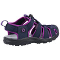 A navy and purple sandal designed for outdoor activities features a sturdy sole and adjustable straps providing support and comfort ideal for hiking or water sports in various environments.