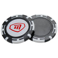 A round poker chip with a black edge and white markings sits on a flat surface featuring a central logo in red and white resembling a shield design with an "M" inside