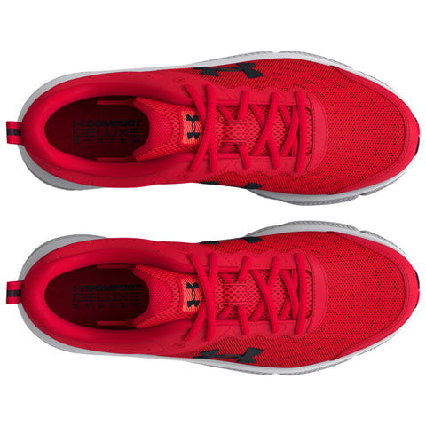 Bright red athletic shoes are positioned side by side showcasing the textured surface and lacing system. The interior features a logo alongside the text "COMFORT DELUXE SYSTEM."