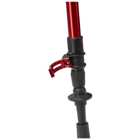 A red and black trekking pole is positioned upright with a locking mechanism engaged. It is made of aluminum and situated against a plain white background, indicating it is ready for use in outdoor activities.