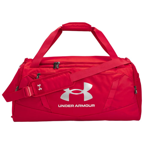 A gray and black duffel bag features dual handles and a shoulder strap with an adjustable buckle it has zippers and displays the Under Armour logo prominently on the side