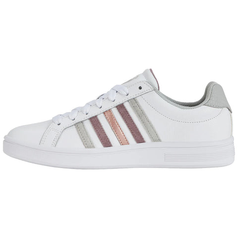 A white sneaker with three stripes in grey and light pink sits horizontally revealing its lace-up design and textured back in a neutral setting.