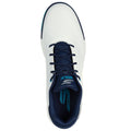 A white golf shoe with navy laces features a textured upper and is designed for performance in golfing contexts. The insole is branded with the word "GOLF" in blue.