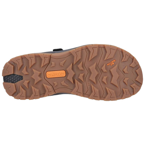 A shoe sole features a rugged, patterned tread designed for traction. The context suggests outdoor use, possibly for hiking or similar activities, emphasizing durability and grip.