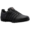 A black athletic shoe with a smooth leather finish displays multiple horizontal stripes and a logo on the tongue sitting on a simple white background showcasing its design and style.