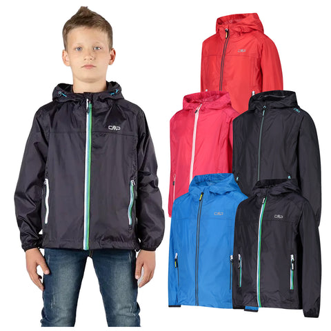 A boy stands wearing a black lightweight jacket with a hood and a front zipper while colorful jackets in red blue and black are displayed nearby against a plain background.