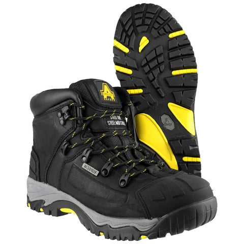 Black high-top boots feature yellow accents and reinforced laces positioned upright with the soles visible showcasing a rugged tread pattern designed for traction in outdoor conditions.