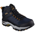 A waterproof hiking boot sits prominently with a textured upper featuring blue and black materials. It has orange accents and a rugged sole, suitable for outdoor exploration and stability.