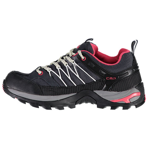 A black and gray hiking shoe is displayed resting on its side featuring a pink interior and laces with a rugged sole designed for grip on uneven surfaces.