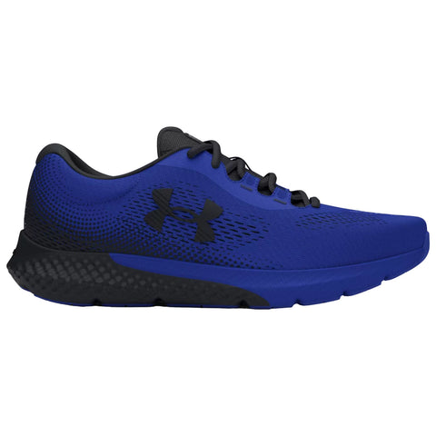 Blue athletic shoe with a black sole is positioned sideways showcasing its sleek design and lightweight construction intended for running or sports activities in a gym or outdoor setting.