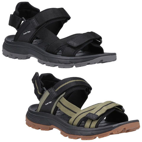 Two pairs of sandals are displayed side by side one is black with thick straps and the second is olive green with black stripes both have chunky rubber soles suitable for outdoor activities.