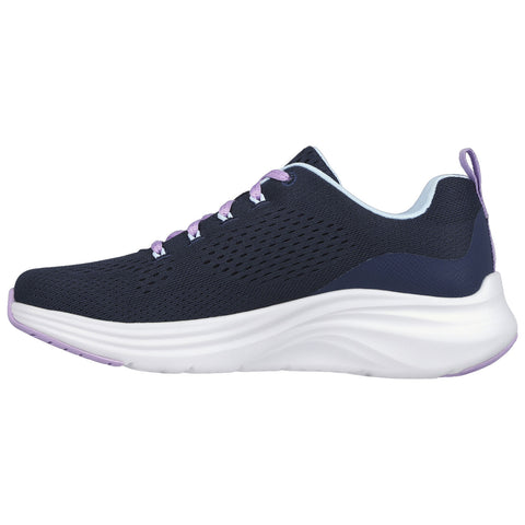 A navy blue athletic shoe features breathable mesh uppers and lilac laces resting on a white cushioned sole designed for comfort and support during physical activities.