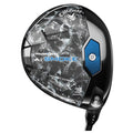 A golf club driver features a sleek black and gray design with blue accents displaying brand and model details surrounded by a reflective surface capable of enhancing performance on the course.