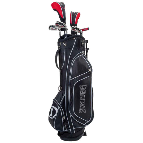 A black golf bag stands upright with several clubs partially visible at the top. The bag features a prominent logo and contrast stitching, indicating preparation for a game on a golf course.