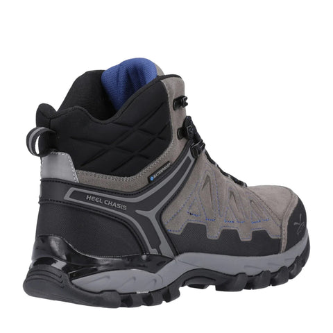 A gray and black hiking boot displays a waterproof label and features a durable sole with a rugged design meant for outdoor activities in an adventurous environment.