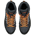 Two hiking boots in black with orange laces and reflective details are positioned side by side. They feature a high top for ankle support and a rugged sole for traction.