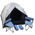 A silver camping tent is set up with its entrance open revealing a dark interior Two blue folding chairs are positioned outside along with two blue inflatable pillows in a clear outdoor space