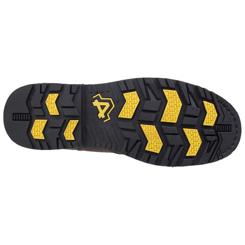 A black and yellow shoe sole features a rugged tread pattern designed for traction and stability on various surfaces showcasing a logo in the center indicating brand identity