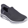 A gray slip-on shoe with a textured mesh upper is positioned at an angle displaying its flexible sole and cushioned collar suitable for casual wear or light activity.