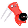 A red golf divot tool features stainless steel prongs and a round magnetic marker labeled LEGEND GOLFER. It is designed for repairing the golf course while on the green.