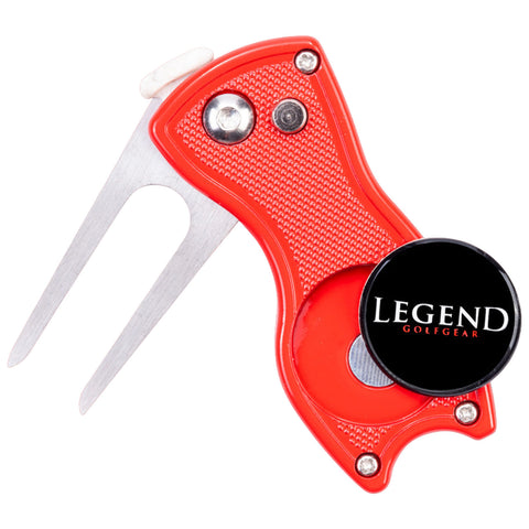 A red golf divot tool features stainless steel prongs and a round magnetic marker labeled LEGEND GOLFER. It is designed for repairing the golf course while on the green.