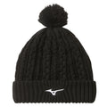 A black knitted beanie sits upright showcasing a ribbed cuff and a pom-pom on top featuring a white logo on the front, suggesting warmth in a cold environment.