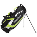 A black and green golf bag stands upright with extended legs showcasing its sleek design and brand name MacGregor prominently displayed on the side, ready for use on a golf course.