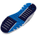 A running shoe's sole features a textured blue and navy design with protruding hexagonal patterns for grip while displaying an Under Armour logo on the heel section.