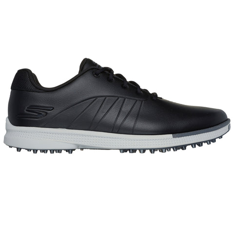 A black athletic shoe with textured sides and a white and black sole is presented standing still against a plain background, emphasizing its design and features for sport activities.