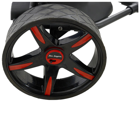 A black and red wheel with a stylish design is visible. It is mounted on a piece of equipment, likely a golf cart, emphasizing a sporty aesthetic in a simple environment.